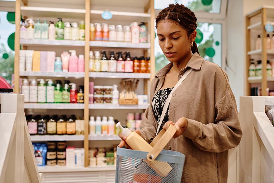 Woman choosing lotion in the store