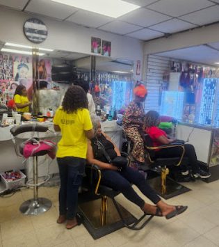 jay african hair braiding inside salon staff braiding hair